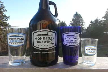 Growler and pint glasses from Monhegan Brewing Company