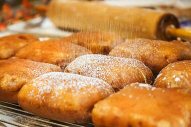 Monte cristo sandwiches getting dusted with powdered sugar at Donut Bar in downtown San Diego.