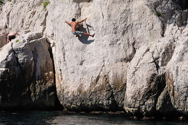 Dude climbing a rock face